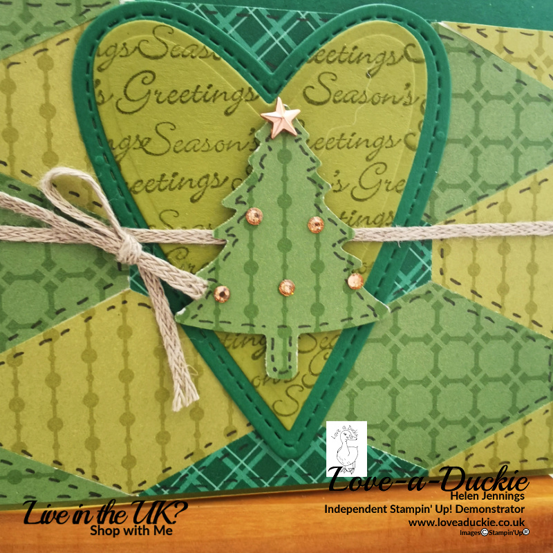 A punched Christmas tree is layered onto stitched hearts on thois quilted paper Christmas card