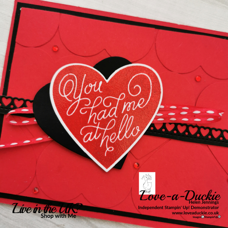 The red heart on this card has been embossed with clear embossing powder to give it shine