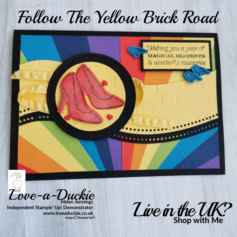 This Wizard of Oz inspired card features rainbows, yellow brick road, blue birds and sparkly red shoes.