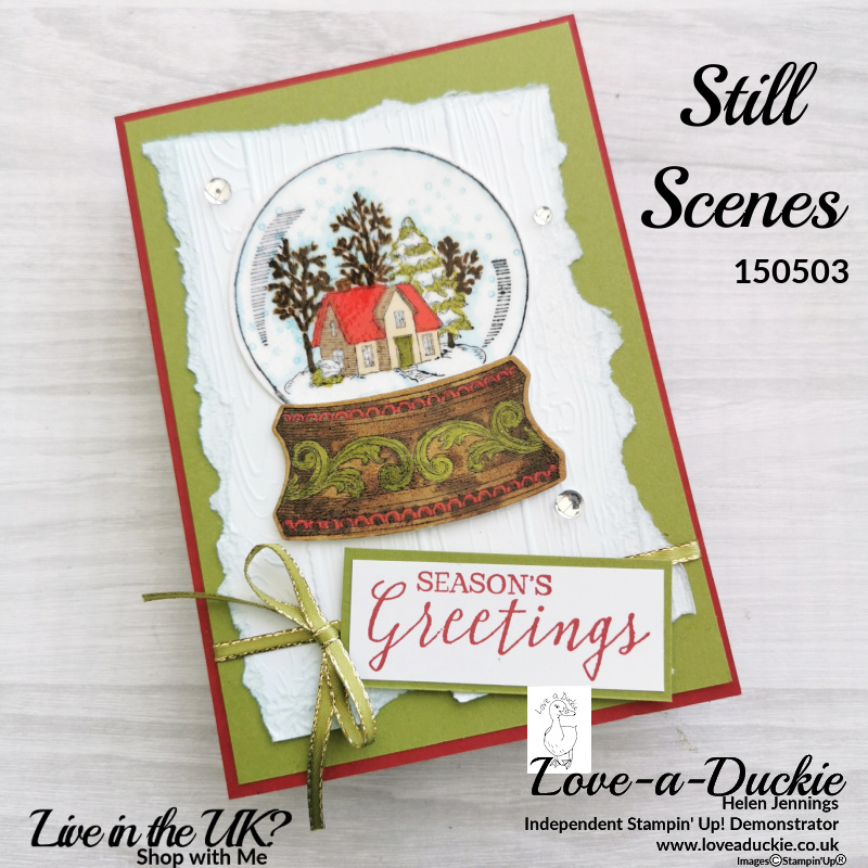 This snow globe Christmas card uses heat embossing and embossing folders to give it shine and texture.