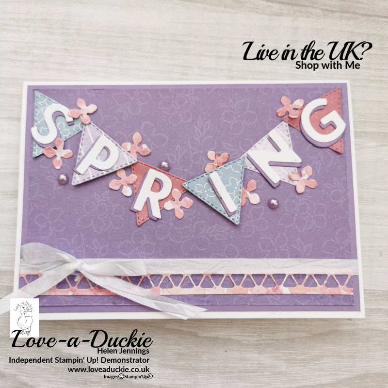 A spring card featuring a banner created using Stampin' Up's stitched triangles and the Playful Alphabet dies.