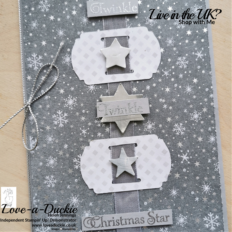 This simple Christmas Card has coordinating ribbon that has been created by colouring white ribbon.