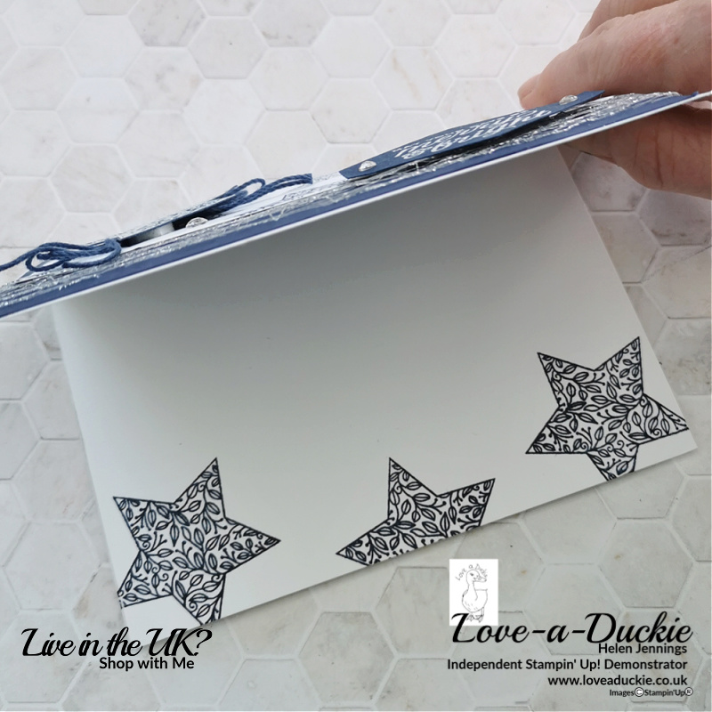 The inside of the card has been stamped with stars from the Tidings & trimmings bundle on this navy & white Christmas card.