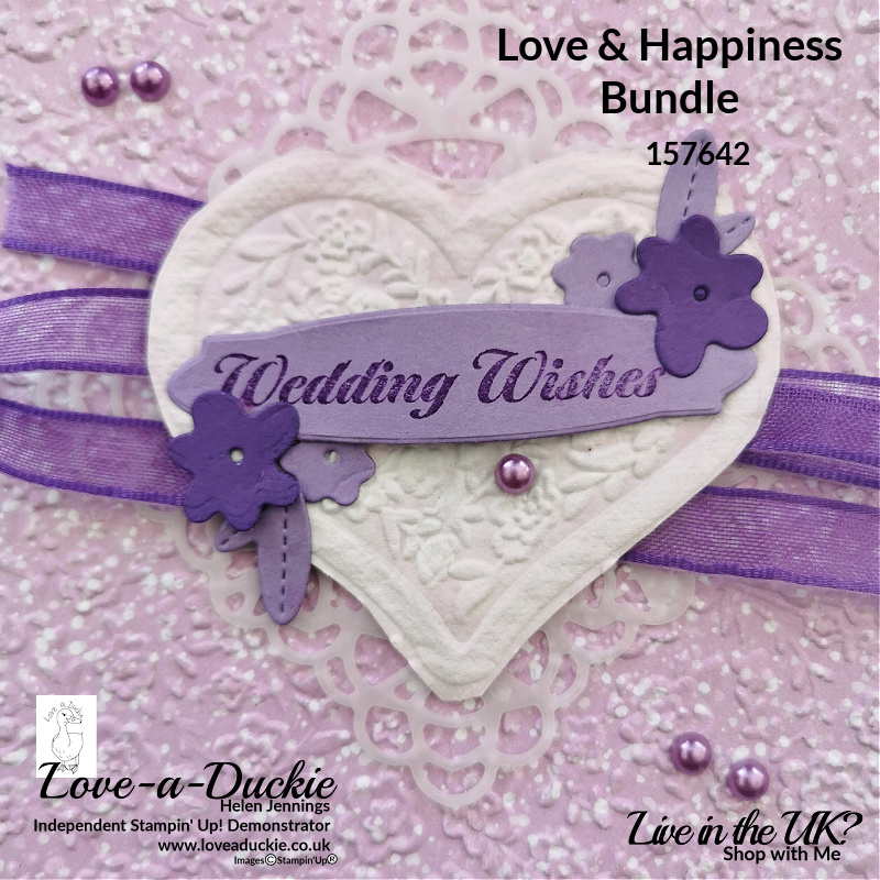 Toilet paper has been spritzed, coloured and embossed to create this embossed heart for a Wedding card.