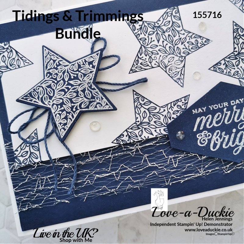 The star has been heat embossed and die cut in this navy and white christmas card using Stampin' up's tidings & Trimmings bundle.