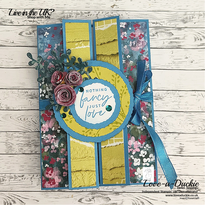 A fancy fold card using Stampin' Up's Masterfully Made Designer Series paper and featuring torn flowers.