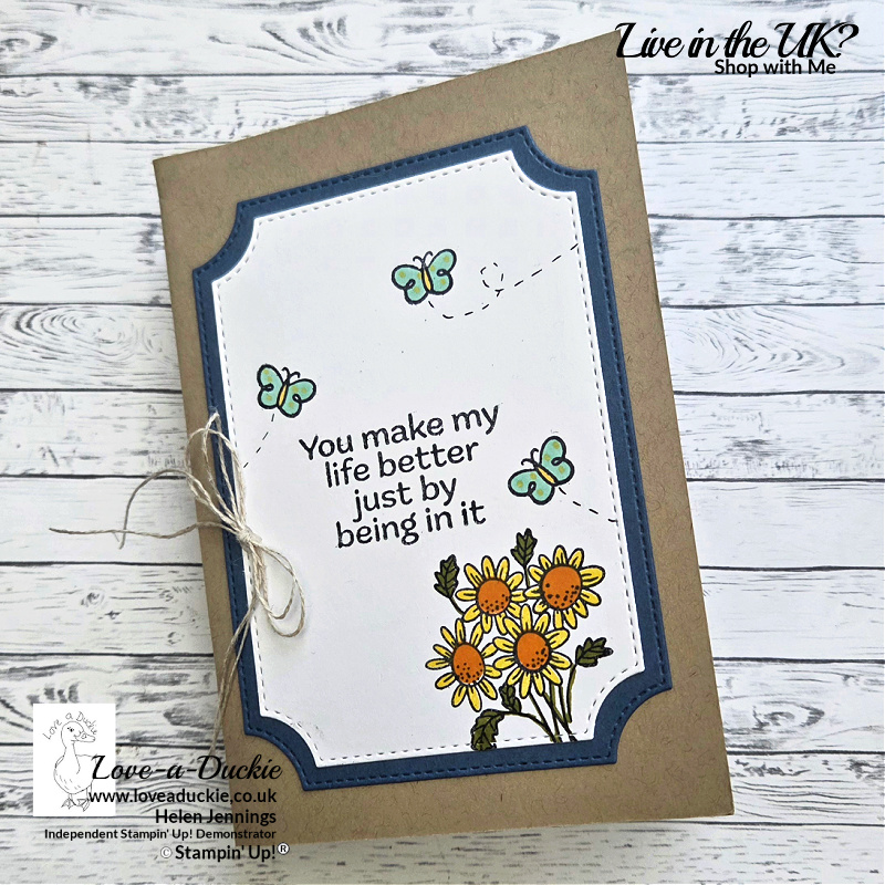 Handmade floral greeting card with stitched layered frame, stamped sunflowers and butterflies from the Pop Up Petals bundle, and the sentiment “You make my life better just by being in it.”