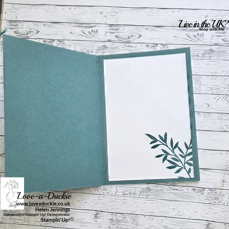 Inside view of a handmade botanical greeting card featuring stamped greenery in soft green tones on a white writing panel mounted onto coordinating cardstock.