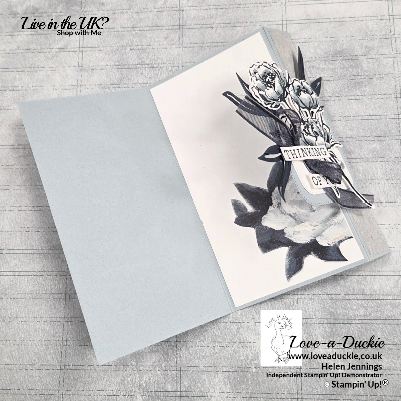 Interactive fold back fun fold sympathy card with Gallery Blooms stamped floral image layered over Beautiful Gallery designer paper with Secret Sea open weave ribbon and thinking of you sentiment.